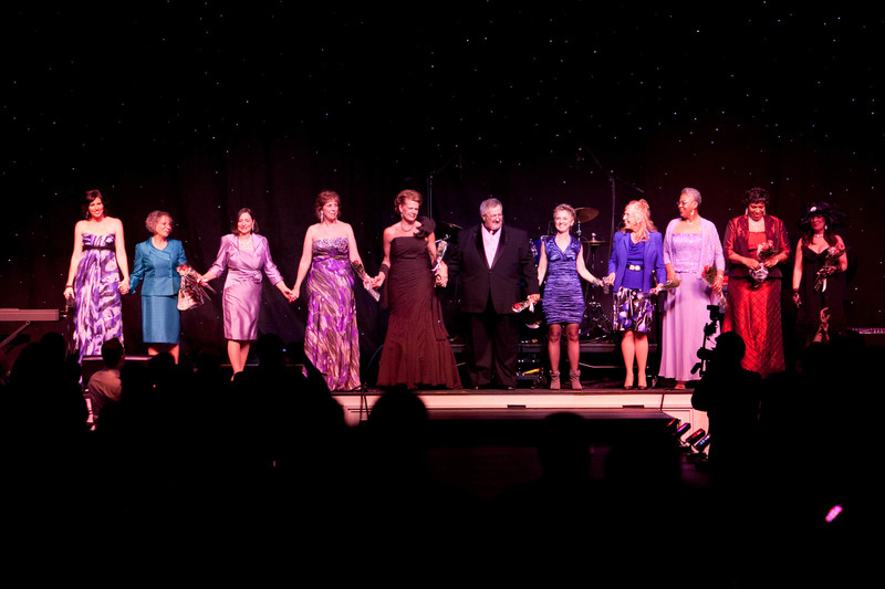 Local breast cancer survivors take the stage as models and take one final bow together at the Southern Lights of Life fundraiser. Shown are (l-r) Michele Munday, Elsa Rodriguez-Trejo, Merry Jones, Connie Holdridge, Gerri Coble, Terry Timmons, Melanie Giangrant, Patricia Wright, Jeralin Rochester, Karen Shockley and Rori Ann Allen. BY BEV MICHEL