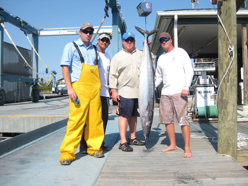 This crew braved high seas offshore aboard their 28-foot center console, but were rewarded with an impressive 61.4-pound wahoo. The big speedster grabbed a ballyhoo in 40 fathoms inshore of the Baltimore Canyon. Pictured at the Lewes Harbour Marina scales are Sean Kane, Geoff McCloskey, Andrew White and angler Phil Falgowski. SOURCE SUBMITTED
