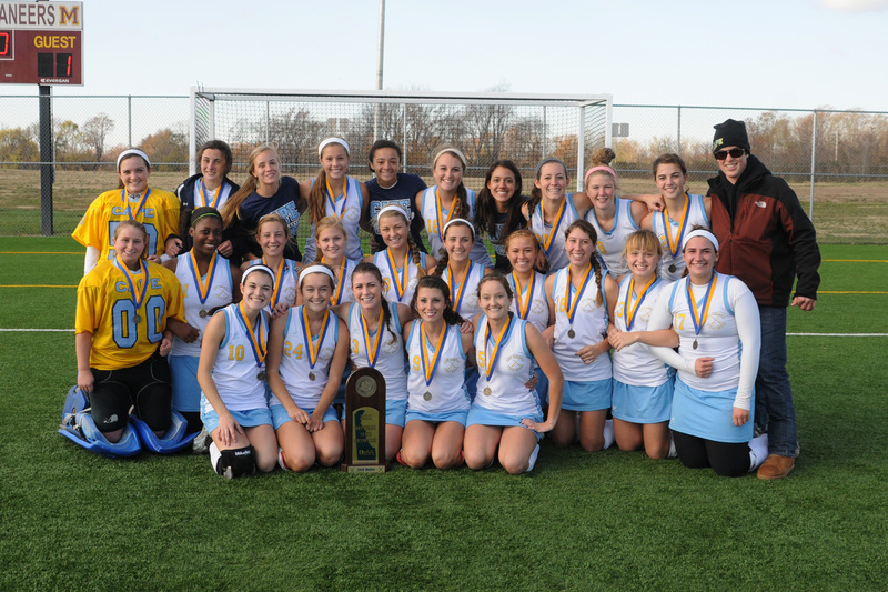 The Cape Henlopen field hockey team poses with the DIAA State Championship trophy after defeating Delmar for the second straight year to take top honors in Delaware high school hockey. Shown are in back (l-r) Tina Gooding, Tess Bernheimer, Claire Carnevale, Alexa Woodruff, Mariko Daisey, Jordan Brown, Alexis Gooch, Marlee McGinness, Samantha Broadhurst, Camryn Bernheimer and manager Charlie Burton; in middle, Katie Kolobielski, Tiara Duffy, Maggie Delp, Amanda Smith, Allie Yeager, Kat Judge, Karissa LeMaire, Sydney Smyk, Amanda Atkinson and Lindsey Voss. In front are Alex Coverdale, Anna Frederick, Sara Young, Izzie Delario and Emily Baptiste. BY DAN COOK