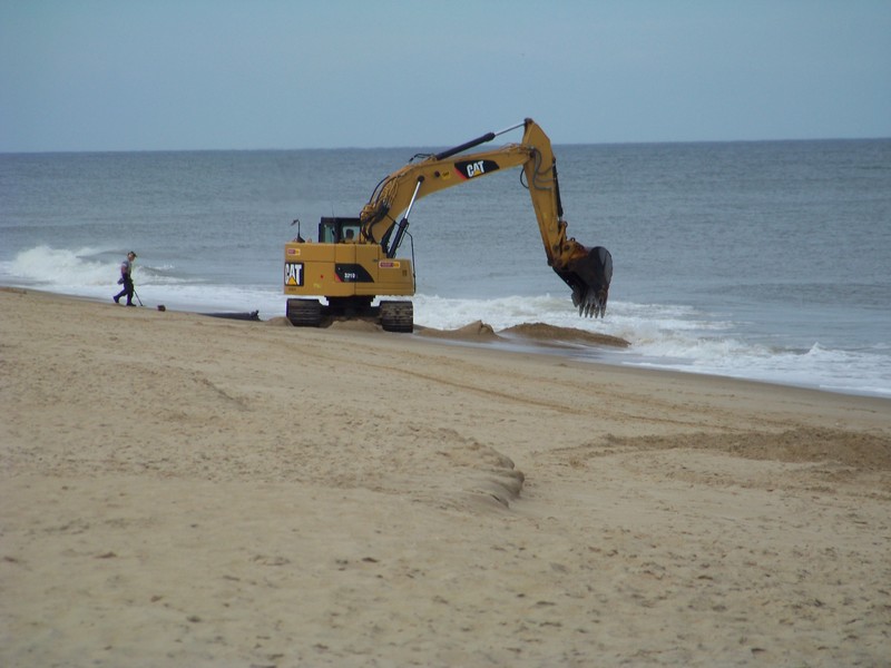 Rehoboth Beach officials unanimously approved contributing $200,000 to put permanent extensions on the stormwater outfall pipe at Rehoboth Avenue. Several stormwater outfall pipes were buried during February's beach replenishment project, and the U.S. Army Corps of Engineers has had an excavator on-site all year to clear the pipes at low tide. BY RYAN MAVITY
