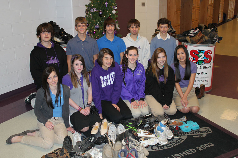 Representatives of DCHS students who participated in the Shoes 2 Share effort include in back (l-r) Logan Fluharty, Hamilton Schlabach, Frank Bolles, Robert Quillen and Austin Smenkowski; in front are Erica Apgar, Makayla Satterfield, Shelby Timko, Angela Baker, Kiera Fry and Alexa Gorman. SOURCE SUBMITTED