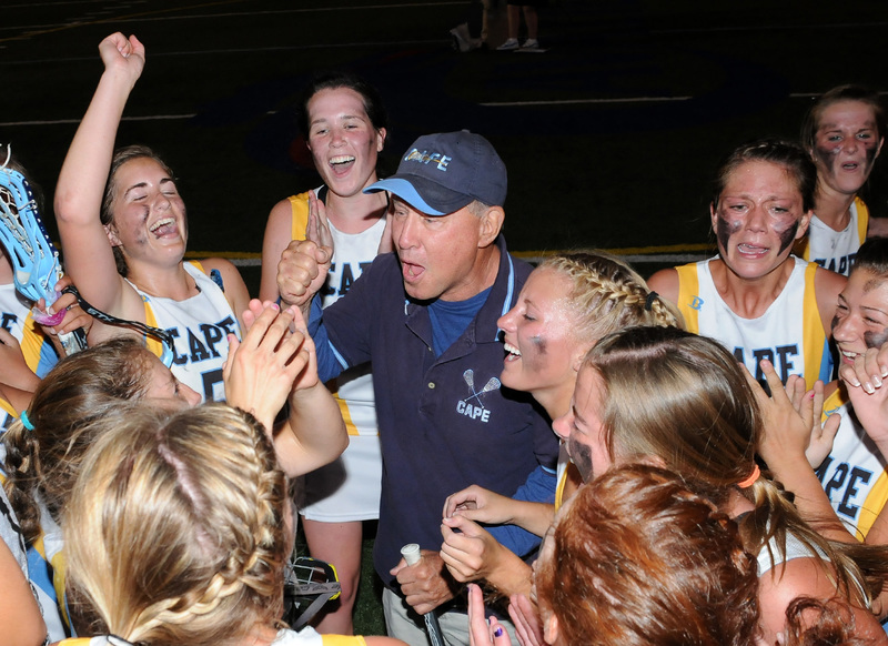 P.J. Kesmodel led Cape's girls' lacrosse team to an undefeated season and its fourth consecutive state championship in 2012. Kesmodel is the only coach in the country to win state championships in boys' and girls' lacrosse while at Mt. Hebron in Maryland and also titles in two states. He is shown here celebrating the 2009 DIAA State Championship. BY DAN COOK