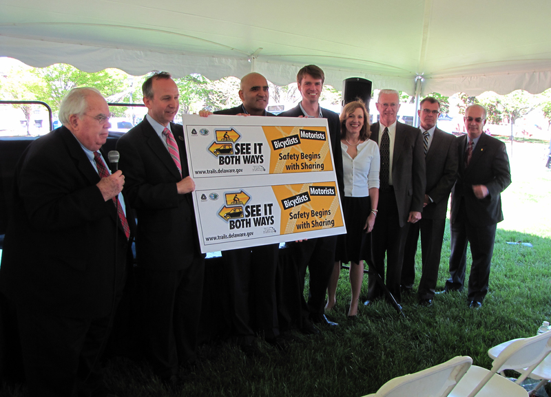 Unveiling the See It Both Way campaign are (l-r) John Hollis, co-chair of the Walkable, Bikeable Summit; Gov. Jack Markell; DelDOT Secretary Shailen Bhatt; DNREC Secretary Collin O’Mara; DHSS Secretary Rita Landgraf; Rep. Harvey Kenton, R-Milford; Rep. Edward Osienski and Rep. Bobby Outten. SOURCE SUBMITTED