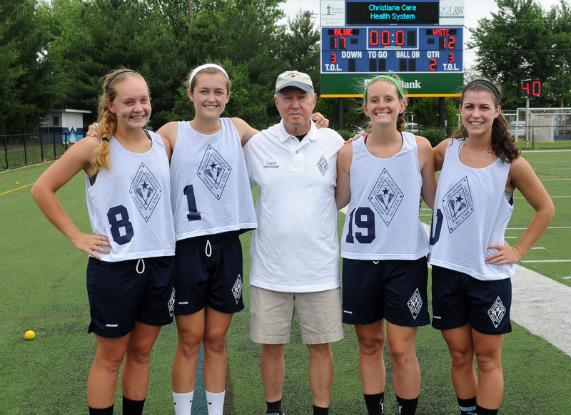 The Delaware Senior All-Star game was a fitting end to high school careers of friends from the Cape community. Shown are (l-r) Sussex Tech's Kellen Cannon, Cape's Anna Frederick, Cape coach P.J. Kesmodel, Tech's Kirstin Lockwood and Cape's Sara Young. This group scored more than 600 goals in the last four years. BY DAN COOK