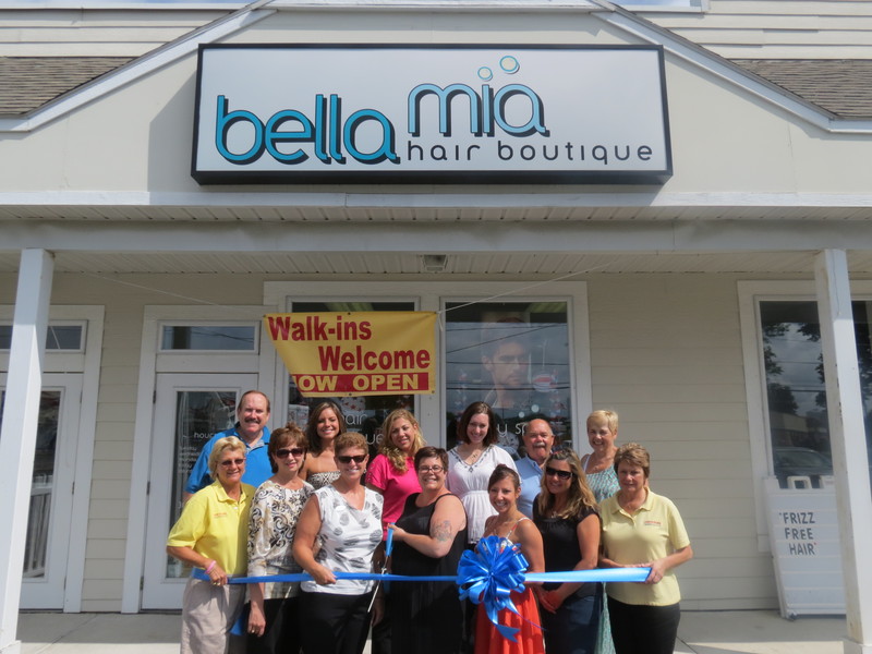 Celebrating the Bella Mia ribbon cutting are in back (l-r) Terry Blackney, Sign*A*Rama; Genevieve Coffield; Kate Carrow; Monica Arseneau; John Zarker and Coralee Zarker; in front are Katie Handy, Sign*A*Rama; Joy Kidd, Rehoboth-Dewey chamber; Kathy Ara, Fulton Bank; Tammi Zarker; Irene Spadaccini; Patty Burkentine, Rehoboth-Dewey chamber; and Gwen Osborne, Sign*A*Rama. SOURCE SUBMITTED