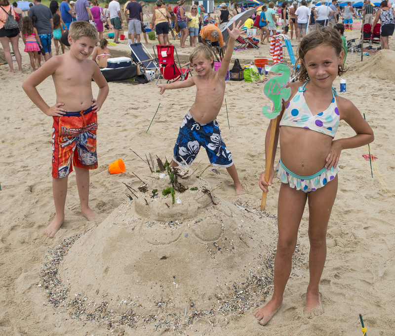 Lenny Williams, 10, and Braden, 8, and Lilly Boyer, 9 won a top 10 Judges' Favorites Award and People's Choice Award for their happy birthday cake for the sandcastle contest. Their families have been veteran sculptors for more than 26 years. BY DENY HOWETH