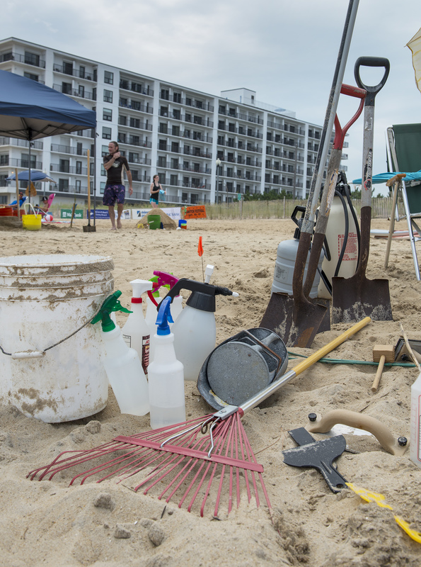 Tools of the trade: several types of misters, buckets for watery sand transport, masonry tools, shovels for heaving sand and a rake for the final touch-up. BY DENY HOWETH