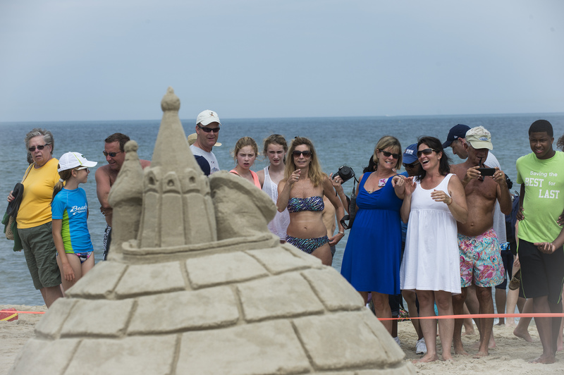 Crowds were tickled by this conceptual piece called "Snow Den," which featured an igloo topped by a satellite dish, a Kremlin spire and a face of Edward Snowden gazing at an Apple laptop. BY DENY HOWETH