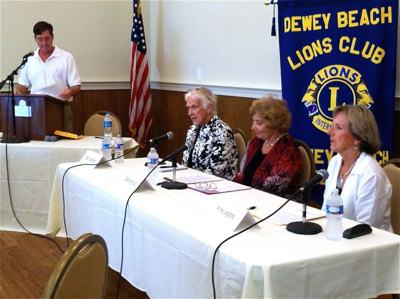 Dewey Beach Civic League President Rob Marshall, left, moderated a candidates' forum, Aug. 24, despite the fact that no election will be held this year in Dewey Beach. Shown seated are (l-r) Property owner Ellen Danaher, Mayor Diane Hanson and Commissioner Anna Legates, who will all be sworn in, Saturday, Sept. 28. BY KARA NUZBACK