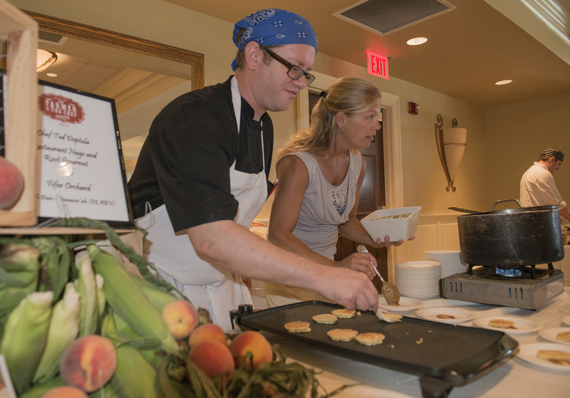 Paul Chell, sous chef, and Nicole Bailey, marketing manager from Nage, plate a tasting in combination with Root Gourmet and Fifer Orchards BY DENY HOWETH