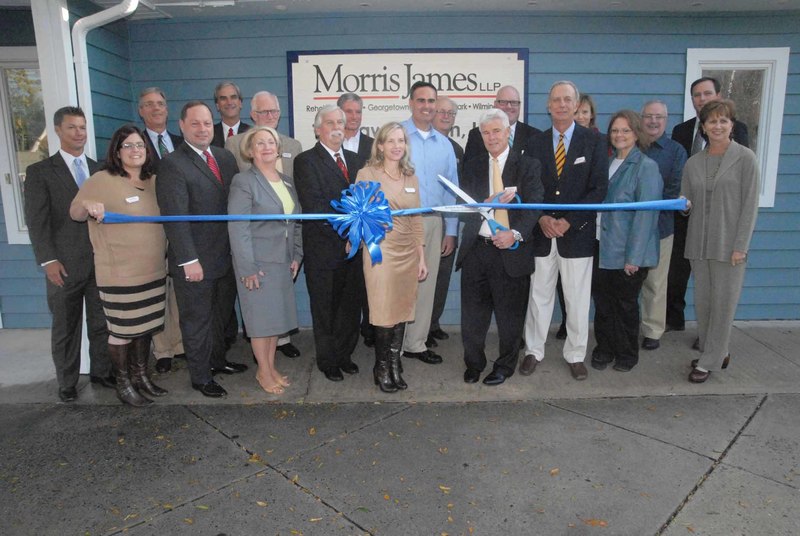 Joining Morris James’ staff at the opening are government officials and members of Rehoboth Beach’s business and community organizations. Shown in back (l-r) are Blue Rock Financial CFP Todd Roselle, Morris James’ Dennis Schrader, John Newcomer, Mark Olson, Coldwell Banker’s Skip Faust, Morris James’ Pete Jones, Peter Ladig, Beth Miller, CAMP Rehoboth Executive Director Steve Elkins and Morris James’ David Hutt. In front are Morris James’ Sherry Perna, Bruce Tigani, Mary Culley, Tom Herweg, Veronica Faust, Sen. Ernesto B. Lopez, Morris James’ David Williams, John Bloxom, Joanne Owens and Rehoboth Beach-Dewey Beach Chamber of Commerce’s Joy Kidd. BY STEVEN BILLUPS
