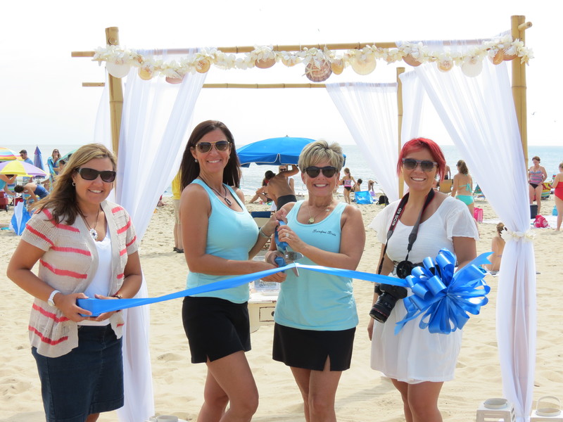 The business community and staff at Barefoot Bride, including Patty Burkentine of the Rehoboth-Dewey Beach Chamber of Commerce; Barefoot Bride Co-Owner/Operator Jodie Noonan; Allison Sappington, Barefoot Bride co-owner/operator and Victoria Vazquez, wedding photographer recently came out to welcome the new wedding planners to the Cape Region. SOURCE SUBMITTED