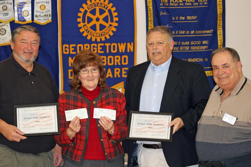 Displaying the first checks from the Georgetown-Millsboro Rotary Club Flags for Heroes campaign are (l-r) Georgetown Mayor Mike Wyatt, former Delaware Secretary of State Harriet Smith Windsor, Millsboro Mayor Bob Bryan, and Georgetown-Millsboro Rotary Club President Stephan Kasperski. SOURCE SUBMITTED