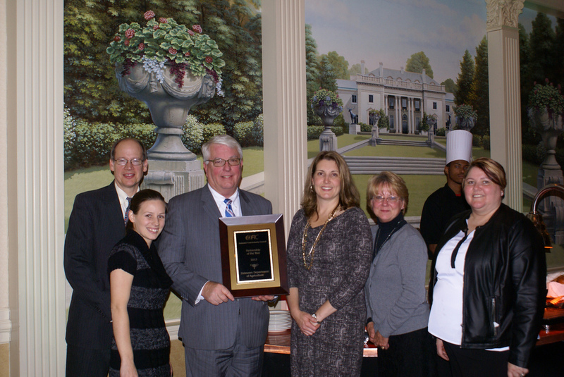 The Delaware Department of Agriculture's staff was presented with the Partnership of the Year Award at the Delaware Food Industry Council's banquet. Pictured (l-r) are marketing specialist David M. Smith, marketing intern Caitlyn Short, Secretary of Agriculture Ed Kee, marketing specialists Holly Porter and Jo-Ann Walston, and administrative specialist Celene Walton.