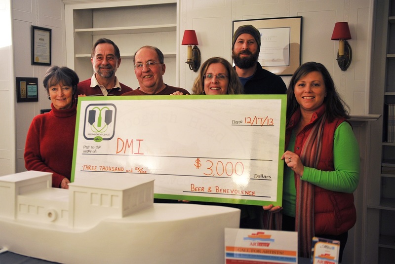 Representatives of Downtown Milford Inc. happily accept a $3,000 award from Dogfish Head Brewery. At the presentation are (l-r) Joan Lofland, owner of the Augusta and Art on the Riverwalk Tour committee member; Lee Nelson, DMI executive director; Irv Ambrose, DMI vice president; Cathy Walls, ART committee member; Mark Carter, Dogfish Head Brewery; and SaraKate Hammer, DMI president. SOURCE SUBMITTED