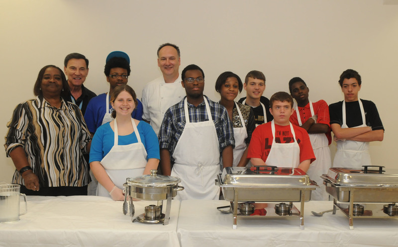 Shown ready to serve lunch to a full room at First State Community action are (l-r) Wiilie May Duffield, Dean Costas, Adrian Griffin, Autumn Danley, Chef Papp, Shaquan Johnson, Emija Best, Brandon West, Robert Smith-Bailey, Le'Ron Holland and and Gary Johnson. Not shown is Anna Marie Schneider. BY STEVEN BILLUPS