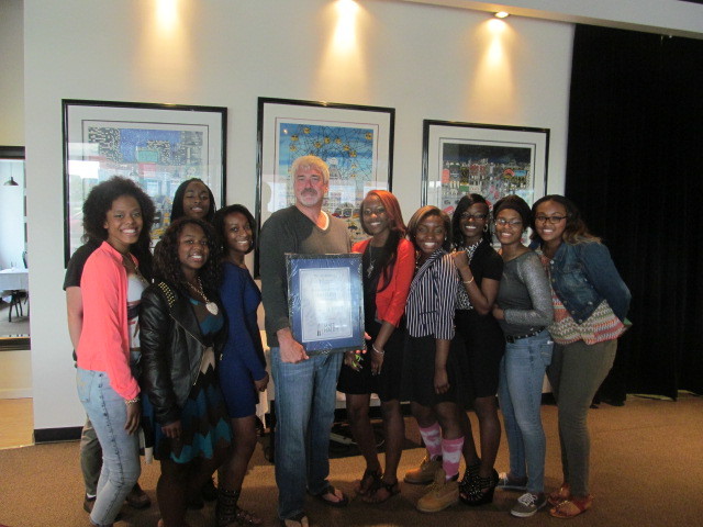 Pathways to Success students gave Matt Haley a signed certificate as a thank you for his presentation to them. Shown are (l-r) Mariah Hendricks, Maria Ferreri (hidden), Alshaya Drummond, Melony Showell, Sha'Mariah Doakes, Haley, Jynequa Drummond, Aleya Tingle, Castaysha Lewis, Janisha Harmon and Kalene Garrison.