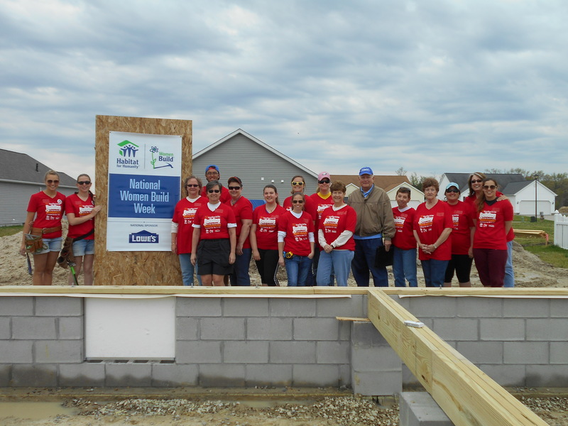Celebrating Women Build Week are (l-r) AmeriCorps member Emily Beck, AmeriCorps member Kerrin Ford, Teresa Cason, AmeriCorps member Adam Grahn, Lynda Schepler, Ruth Sivils, Madeline Robinson, Khara Landon, Stephanie Hartsoe, SCHFH partner family member Theresa Dorrell, Linda Williams, Lowe's representative George Doxzen, Susan Breznak, Suzanne Worrall, Catrina Sharp, Jacquie Sanders and Michelle Lessard. SOURCE SUBMITTED