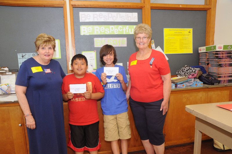 Shown in front of their classroom after reading their essays are (l-r) Judy Stranch, Americanism essay chair; Jayven Escalante-Lopez, third place; Nicholas Vieira, first place; and Nancy Lawrence, Post 5 Ladies Auxillary president. Not shown is second place winner Zander Flores-Reyes. BY STEVEN BILLUPS