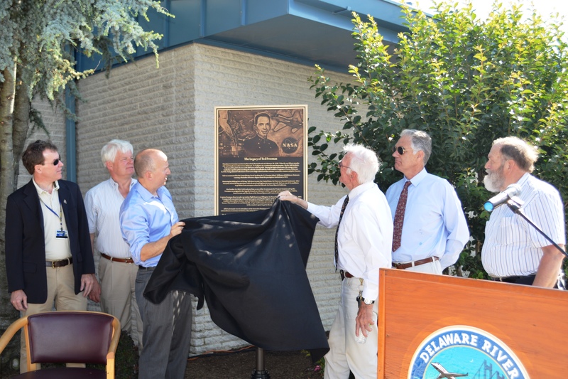 Delaware Governor Jack Markell (left) and Ted Freeman’s best friend, Joseph Hudson (right), remove the canvas to unveil the new commemorative plaque, “The Legacy of Ted Freeman,” as Bruce Freeman of Virginia and Brook Freeman of Lewes, DE (respectively to the right of Mr. Hudson) look on. A second plaque will be installed at a later date on Freeman Highway where bicyclists who are using the new trail can view the plaque. To the left of Governor Markell is the Mayor Ted Becker of Lewes, Delaware, and DRBA Commission Vice Chairman Bill Lowe. BY DRBA