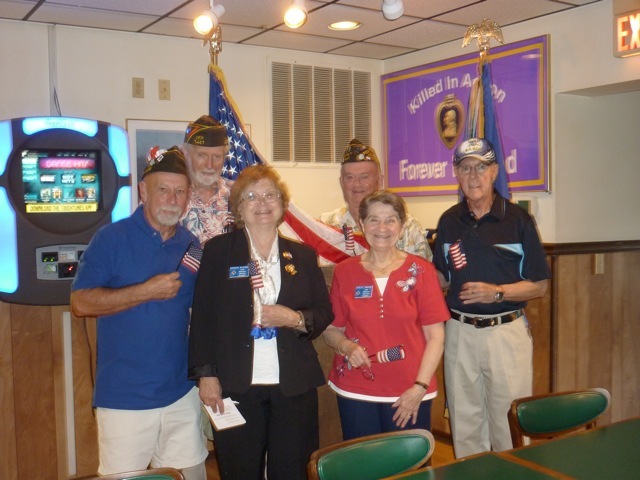 Holding flags in honor of Flag Day are (l-r) Rehoboth VFW Post Commander Bob McGinniss, Post Chaplain Greg Gause, Patriotic Instructor Barbara McGowan, Post Quartermaster Art Frampton, State Ladies Auxiliary Patriotic Instructor and Americanism Chair Estelle Tabasko, and Men's Auxiliary President Ed Schaefer. SOURCE SUBMITTED