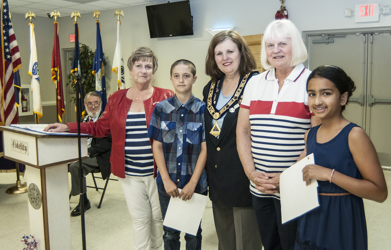Cape Henlopen Elks present essay winners with certificates. Shown (l-r) are Barbara Romspert, Americanism Committee chair; Ria Kapuria, Shield Elementary essay winner; Eileen Loftus, exalted ruler; Barbara Havrilla, Americanism co-chair; and Dylan Rezac, Shields Elementary essay winner. BY DENY HOWETH