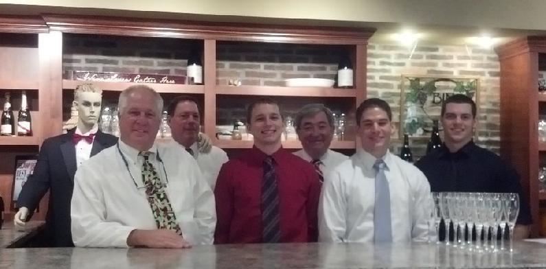 Bin 66 welcomed its 4,000th wine club member over the July 4 weekend. Professional wine staff includes (l-r) Greg the Mannequin, Mike Ohr, co-owner Tom Poor, Jared Dulin, Dave Zorb, Ryan Riordan and Jake Murray. Missing from photo are co-owner Tom Bachmann, Karen Dawson, Michael Kane, Don Cammiso and intern Giulietta Pinna. SOURCE SUBMITTED