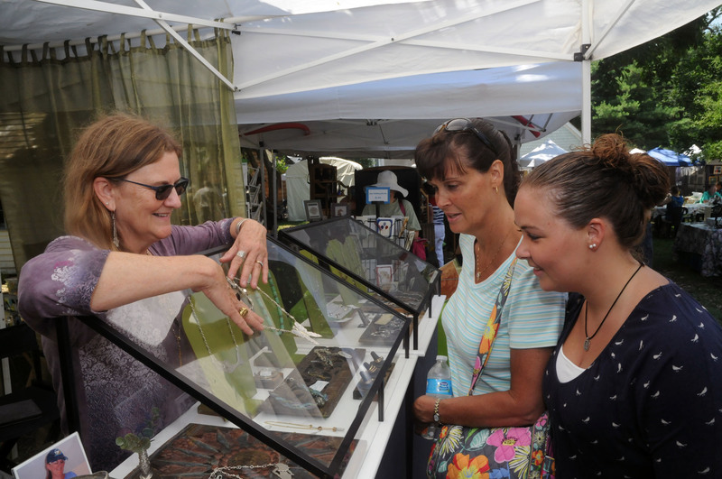 The Summer Craft Fair featured artist was Susan Bartley, left, of Lewes. Bartley works with sterling silver, fine silver, 14k gold, 18k gold, rose gold and hand selected gemstones. “All of my jewelry designs are original and start out as a sketch,” says Bartley. “From there I hand-fabricate each piece in my studio.” Bartley’s jewelry lines consist of necklaces, bracelets, earrings, and rings, which she says are “strongly influenced by the natural beauty of the beaches along the East Coast as well as my own gardens.” Bartley discusses her jewelry with Cindy, center, and Brooke Plummer. BY STEVEN BILLUPS