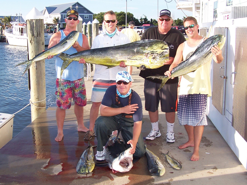 Butch Emmert of Rehoboth gets some help from Jamie King of Milton holding his pending new Delaware state record dolphin. The fish weighed in at 56.9 pounds and measured 54 1/4 inches fork length and had a 32 1/2-inch girth. Butch caught this monster while fishing on the Elizabeth Jane at the 60-fathom Line at the tip of the Baltimore Canyon on a ballyhoo with a blue-and-white Ilander. Also on the trip were Greg Catts of Milton, Capt. Jason King of Lewes and Butch's son, Will, of Milton. Along with the record dolphin, they landed some other smaller dolphin and a 102-pound mako shark. COURTESY HOOK EM AND COOK EM