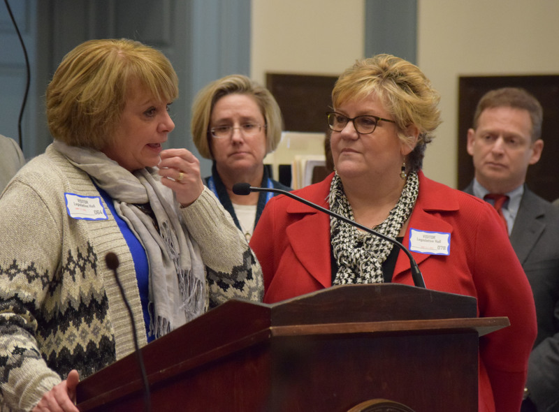 Lisa Cerklefskie, left, who lost her son to an overdose last year, speaks in the Delaware Senate Chambers Jan. 20 as two pieces of legislation were introduced, one of which will create a new criminal charge for drug dealing resulting in death. Also shown (l-r) are Jeanne Keister of atTAcK Addiction, her sister-in-law Cheryl Doucette and Attorney General Matt Denn. BY MADDY LAURIA