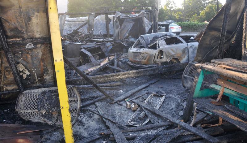 The car that ran into Ed’s Chicken and Crabs at the intersection of Route 1 and Swedes Street in Dewey Beach is still inside what is left of the resort landmark. Several fire departments responded to the fire around 2 a.m. Aug. 9. No injuries were reported. Dewey Beach Police and the Delaware Fire Marshal’s Office are still investigating the incident. RON MACARTHUR PHOTO