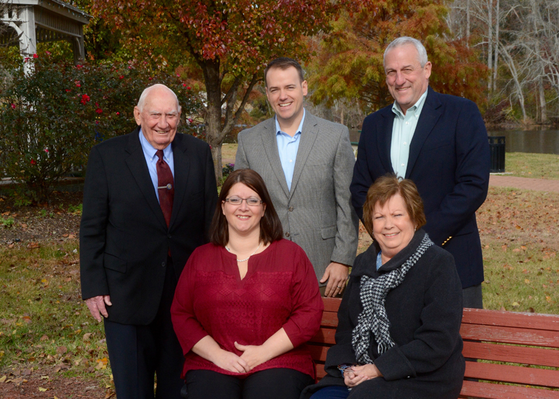 Avery Hall Insurance President Joseph Gast meets with retiring and incoming staff of the Gordy Insurance Agency in Milton. They are (sitting l-r) Dawn Porter, account representative, and Renee Fjelsted, retiring president, and (standing l-r) founder Frank Gordy, Randy Brown, insurance agent, and Gast. RON MACARTHUR PHOTO