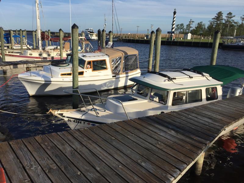 At 22 feet, Nellie Lankford, in the foreground here, is usually the smallest cruiser we see on our travels. But not at the Alligator River Marina. Ted and Brenda Bost, from Wrightsville Beach, had ducked into the marina during their journey between Wrightsville and Edenton. Their little diesel-powered cruiser named Favrile - a sea-glass green - measures in at 21 feet. Bost said the vessel is a Bruce Roberts-designed longboat that makes about six or seven knots. Compact comes to mind. She’s in the next slip over, beyond Nellie.
