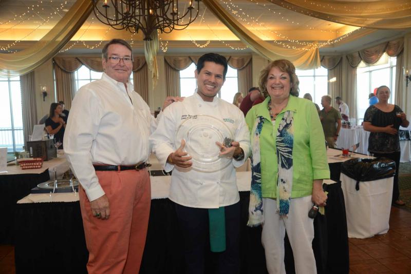 Chef Danio Somoza from 99 Sea Level in Bethany Beach was awarded Top Chef for the second year in a row. Somoza prepared seared black sea bass and dayboat scallops. Shown are (l-r) Meals on Wheels Lewes-Rehoboth Board President John Wolfle, Somoza, and Event Co-Chair and Board Member Lana O’Hollaren. Somoza also won Best Reinvention of a Delmarva Tradition and Top Chef. Top Chef