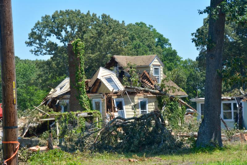 Crews are removing several acres of woods and tearing down several abandoned buildings along Route 24 between Love Creek bridge and Peddler’s Village to make way for the Pelican Landing shopping center. The 87,800-square-foot center was approved by Sussex County officials eight years ago. The developers received a zoning change from AR-1 to B-1 neighborhood business district. RON MACARTHUR PHOTO