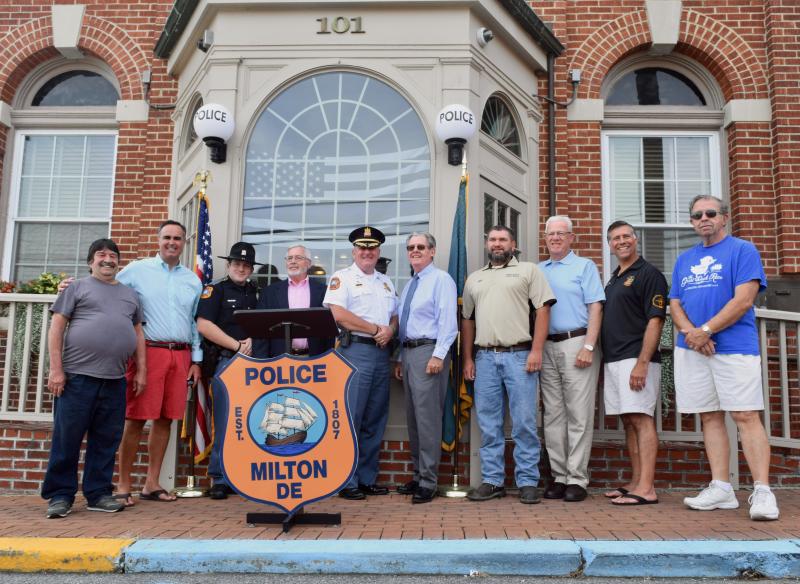 Showing support for the Milton Police Department are (l-r) Milton Councilman Emory West, state Sen. Ernie Lopez, Milton Patrolman Nick Bogan, Milton Mayor Ted Kanakos, Milton Police Chief Robert Longo, Milton Councilman Kevin Kelly, Milton Public Works Supervisor Greg Wingo, state Rep. Harvey Kenton, state Rep. Steve Smyk and Milton Councilman Charlie Fleetwood. MADDY LAURIA PHOTOS