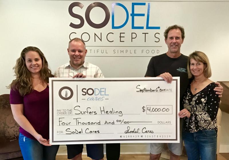 SoDel Cares, the philanthropic arm of SoDel Concepts, recently donated $4,000 to Surfers Healing, which uses surfing to enrich the lives of people with autism. Shown are (l-r) Lindsey Barry, controller for SoDel Concepts; Kris Medford, general manager of NorthEast Seafood Kitchen in Ocean View; and Dale and Kelly Loesner, owners of Quiet Storm in Rehoboth Beach. SUBMITTED PHOTO