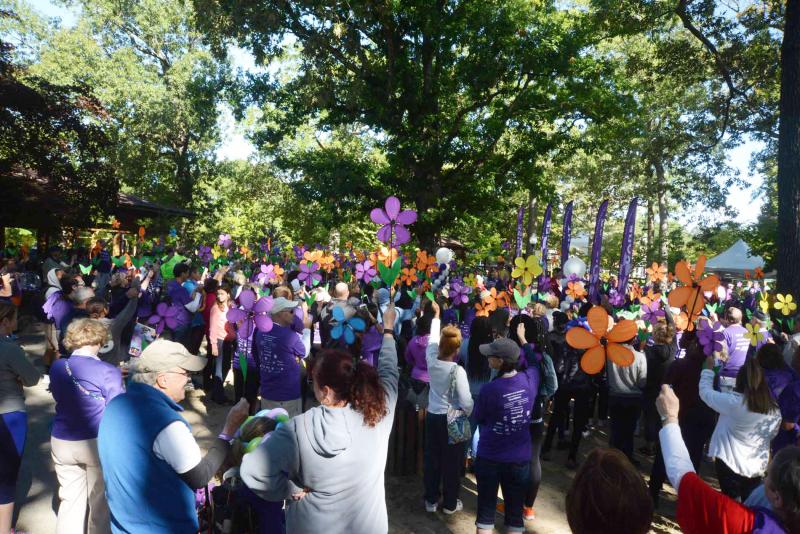 Prior to the walk, participants raise flowers creating a Promise Garden. A blue flower represents someone with Alzheimer’s or dementia; a purple flower is for someone who has lost a loved one to the disease; a yellow flower represents someone who is currently supporting or caring for someone with Alzheimer’s; and an orange flower is for everyone who supports the cause and vision of a world without Alzheimer’s. Alzheimers walk