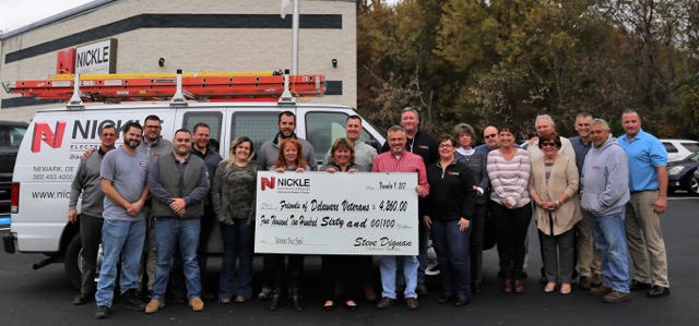 Nickle Electric team members pose with a donation check for the Delaware Veterans Trust Fund. Shown are (l-r) Stan Twardus, Ryan Wade, Jeromy Newton, Scott Estep, John Guhl, Kelly Dignan, Brandon Cale, Kris Hoffman, Jennifer Thompson, Steven Stewart, Mark Benson, Eric Webb, Jenny Yoder, Susan Fleming, Matt Healy, Heather Shupe, John DeMatteis, Pat Lynam, Neal Donaldson, Mike Burchfield and Bill Boyd. SUBMITTED PHOTO