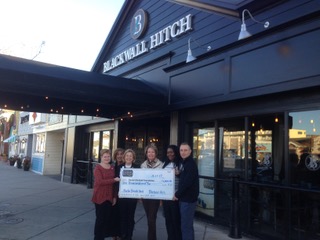 Posing with the donation check to Beebe Medical Foundation are (l-r) Sue Olkowski, GFWC Zwaanendael Women's Club vice president; Robyn Rosenfeld-Aburrow, Beebe Bash co-chair; Judy Aliquo, Beebe Medical Foundation president; Dianne Stevens, clothing distribution chair; Victoria Salazar, Blackwall Hitch front-of-house manager; and Zach Diogo, Blackwall Hitch manager. SUBMITTED PHOTO