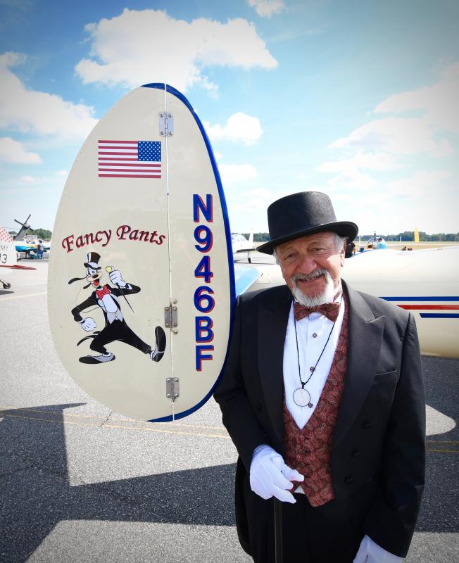 John Chirtea, a well-known Milton-area pilot and collector, is dressed to match the name of his plane, Fancy Pants, one of three he owns.