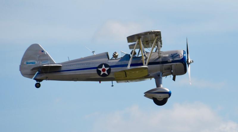 The Stearman Silver Queen takes flight over the airport. The biplane was the primary trainer for the U.S. military during World War II.