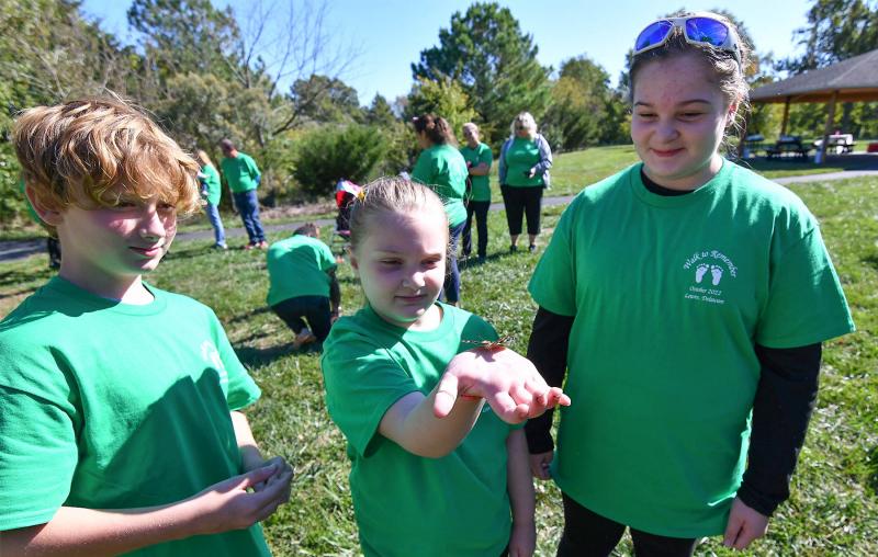 Releasing a butterfly are (l-r) Porter Wyatt-Longfellow, 11; Lynzee Hudson, 7; and Haylie Hudson, 11.