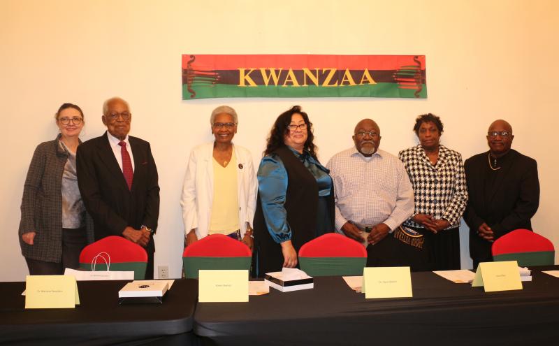 The Sunshine Circle Club recognized community members and its 61st anniversary during its celebration of Kwanzaa Dec. 30. Gathered are award recipients (l-r) Nancy Alexander, the Rev. George Edwards Sr., Dr. Marlene Saunders, Karen Barner, Louis Riley, Gilda Howard standing in for award winner Dr. Joyce Robert, and the Rev. Tony Neal. ELLEN DRISCOLL PHOTOS