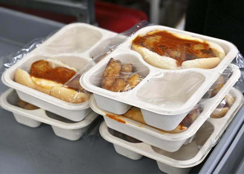 The March 18 lunch delivery includes a meatball sandwich, fries and a salad. Each meal is designed to provide balanced nutrition for the recipient.