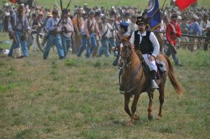 Troops advance during the 150th anniversary recreation of the Battle of First Bull Run. BY RON MACARTHUR