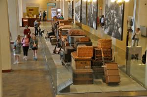 Before being processed, immigrants left their baggage to be claimed later. Not everything left in the luggage – especially valuables – remained. BY RON MACARTHUR