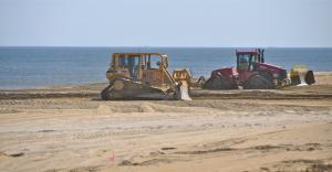 Beach nourishment work continues along Rehoboth Beach as part of a $40 million project to rebuild Delaware's beaches. BY RON MACARTHUR