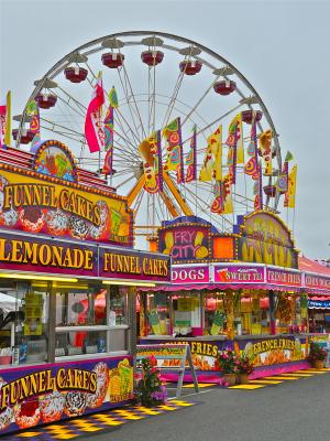 The rides, games and lights of the Midway are a major attraction at the fair each summer. BY RON MACARTHUR