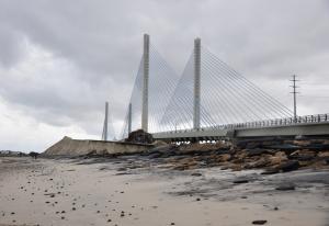 Erosion of the dune is evident where the roadway used to lead up to the old Indian River Inlet bridge. BY NICK ROTH